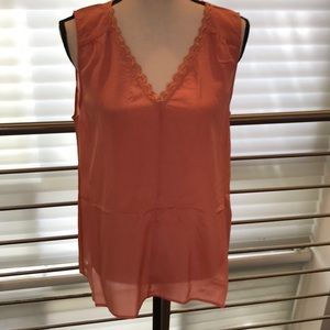 Pretty peach colored sleeveless blouse.  Sundance